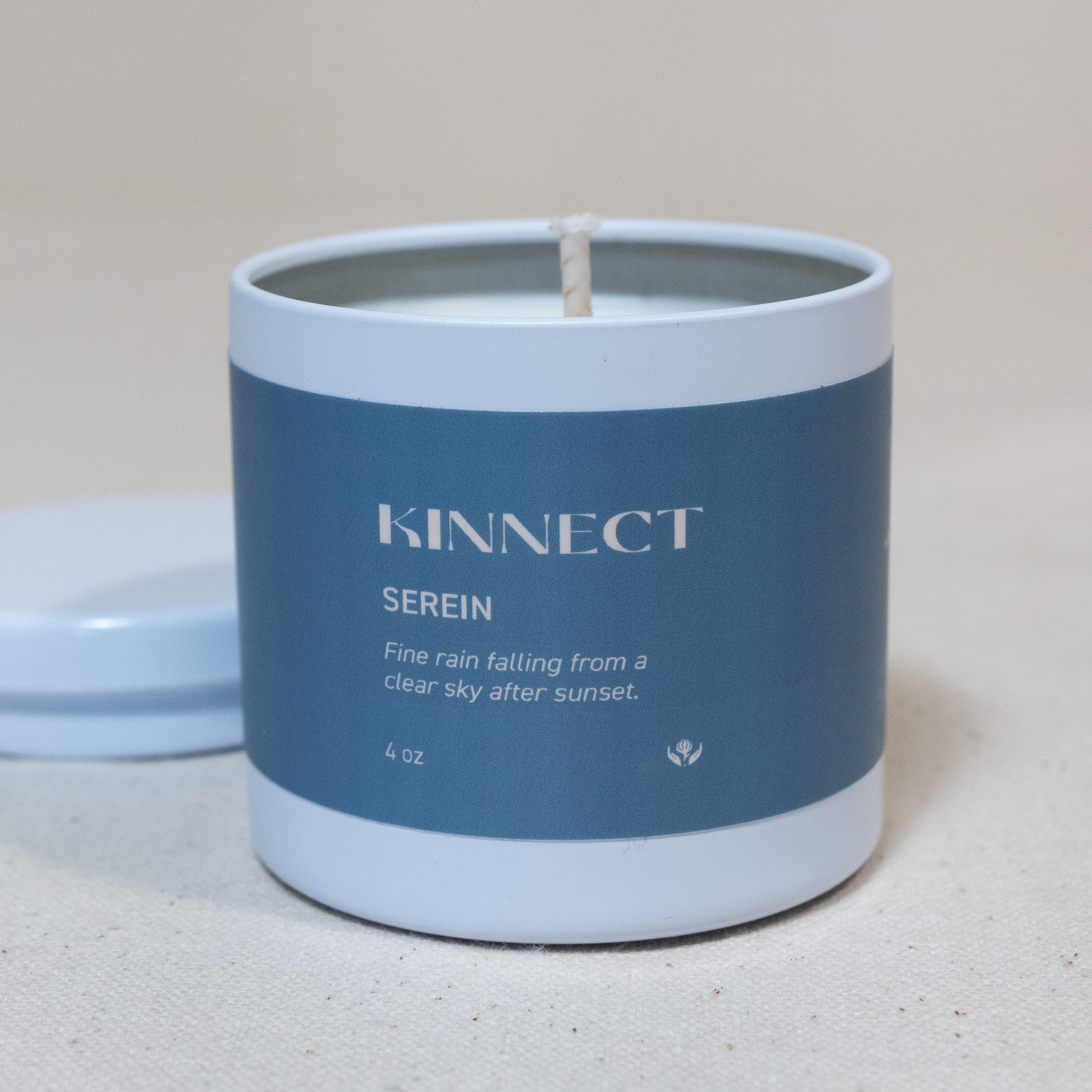 Serein Candle with blue label featuring the brand 'KINNECT' on a light background