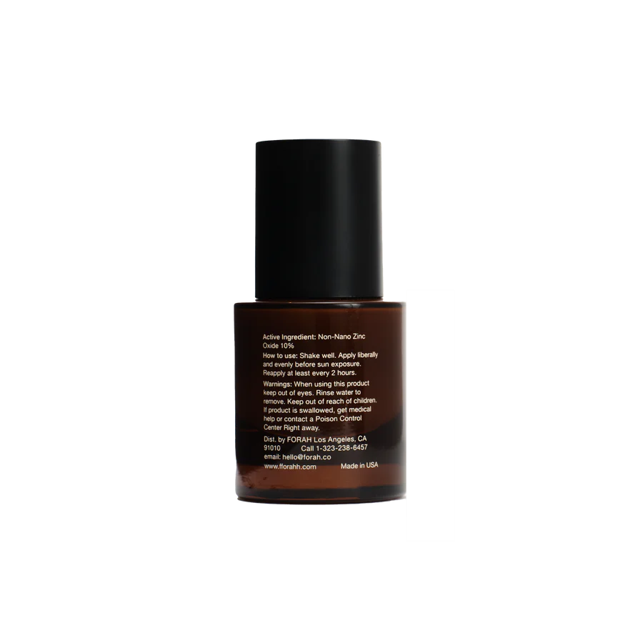 Skincare bottle with black cap and brown body on a white background