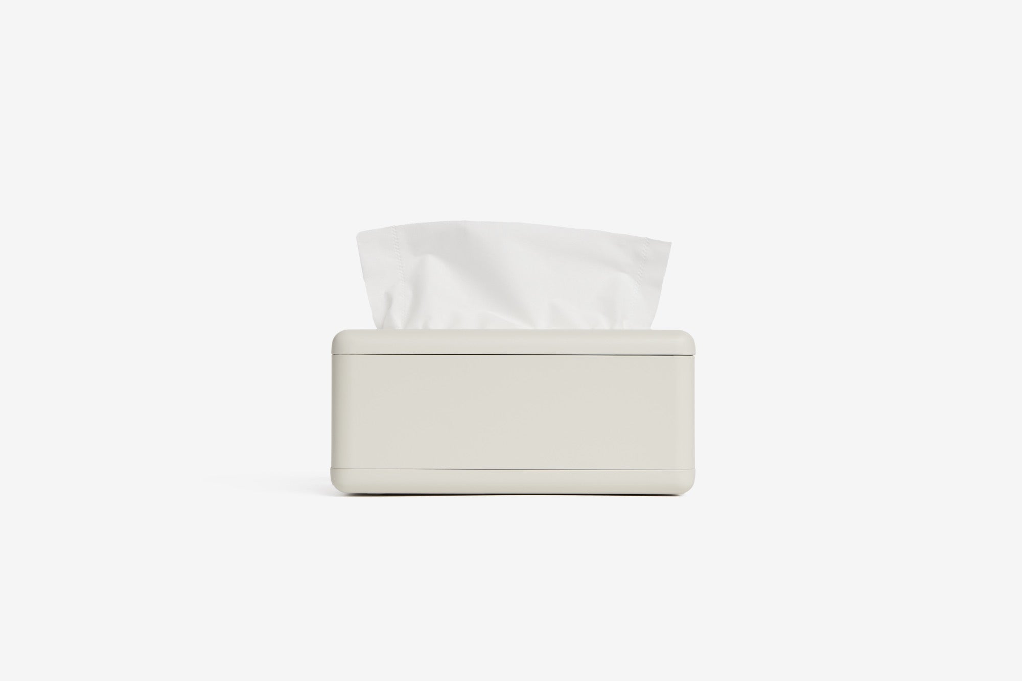 Fox Fold bamboo tissue paper sits in a white fox fold tissue dispenser in a white room