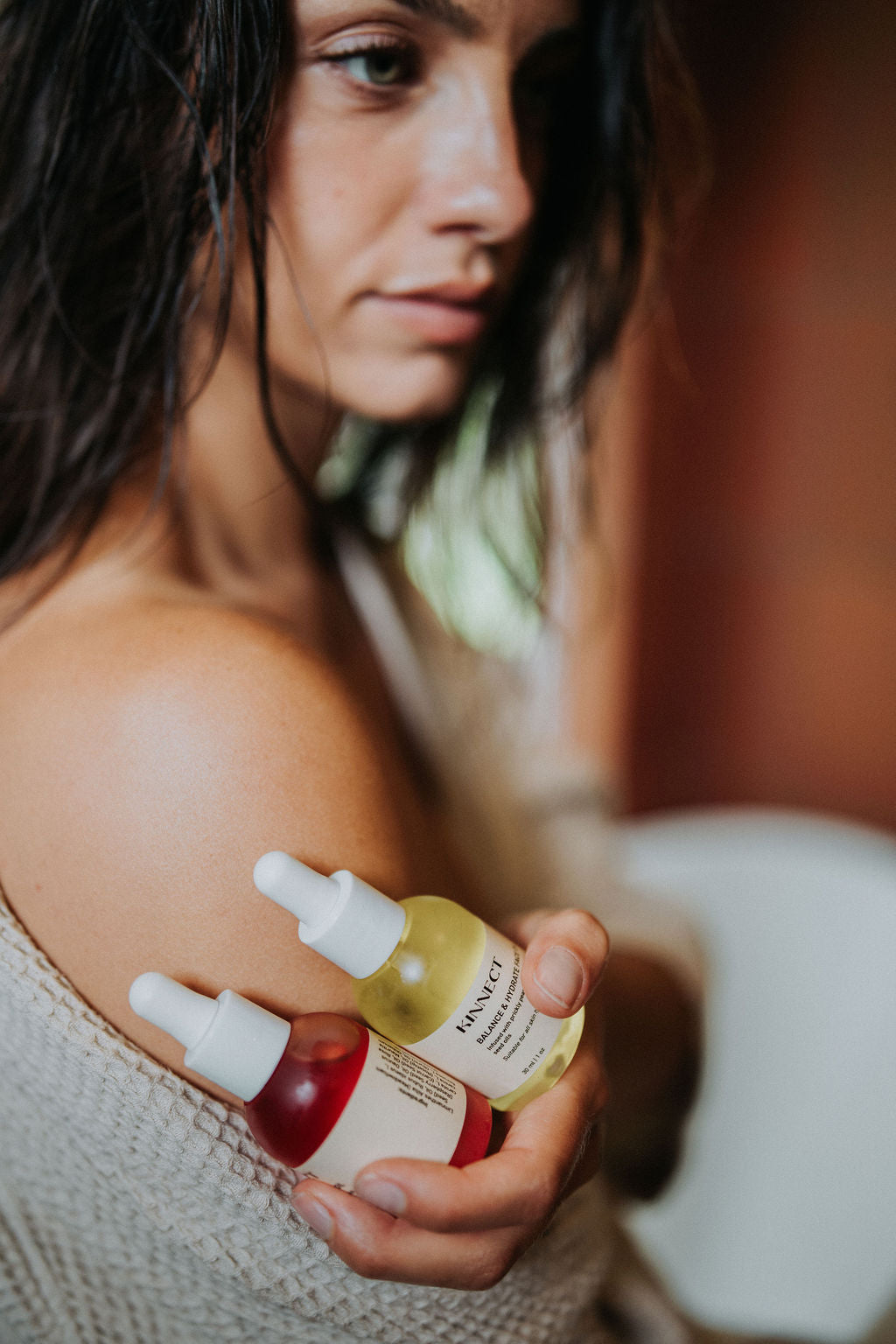 Model holds balance and hydrate and deep repair face oils