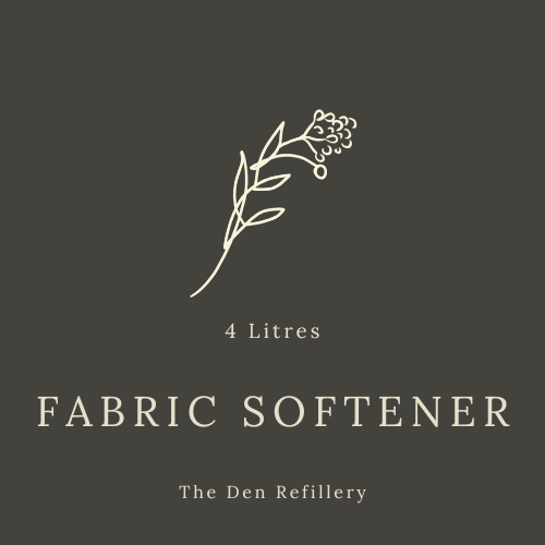 The den Refillery black fabric softener label with an illustrated salal branch and white lettering