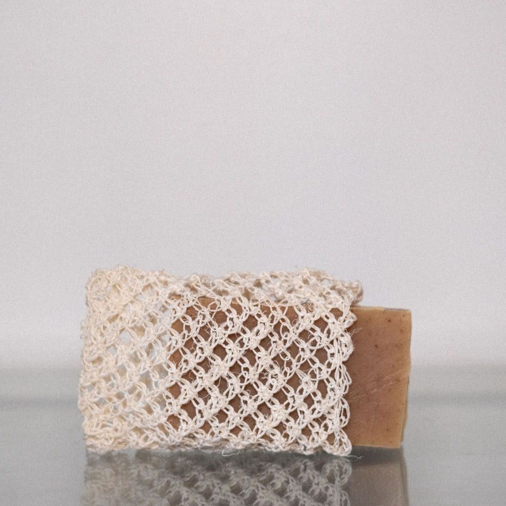 An agave body cloth with a Den refillery beach soap inside.