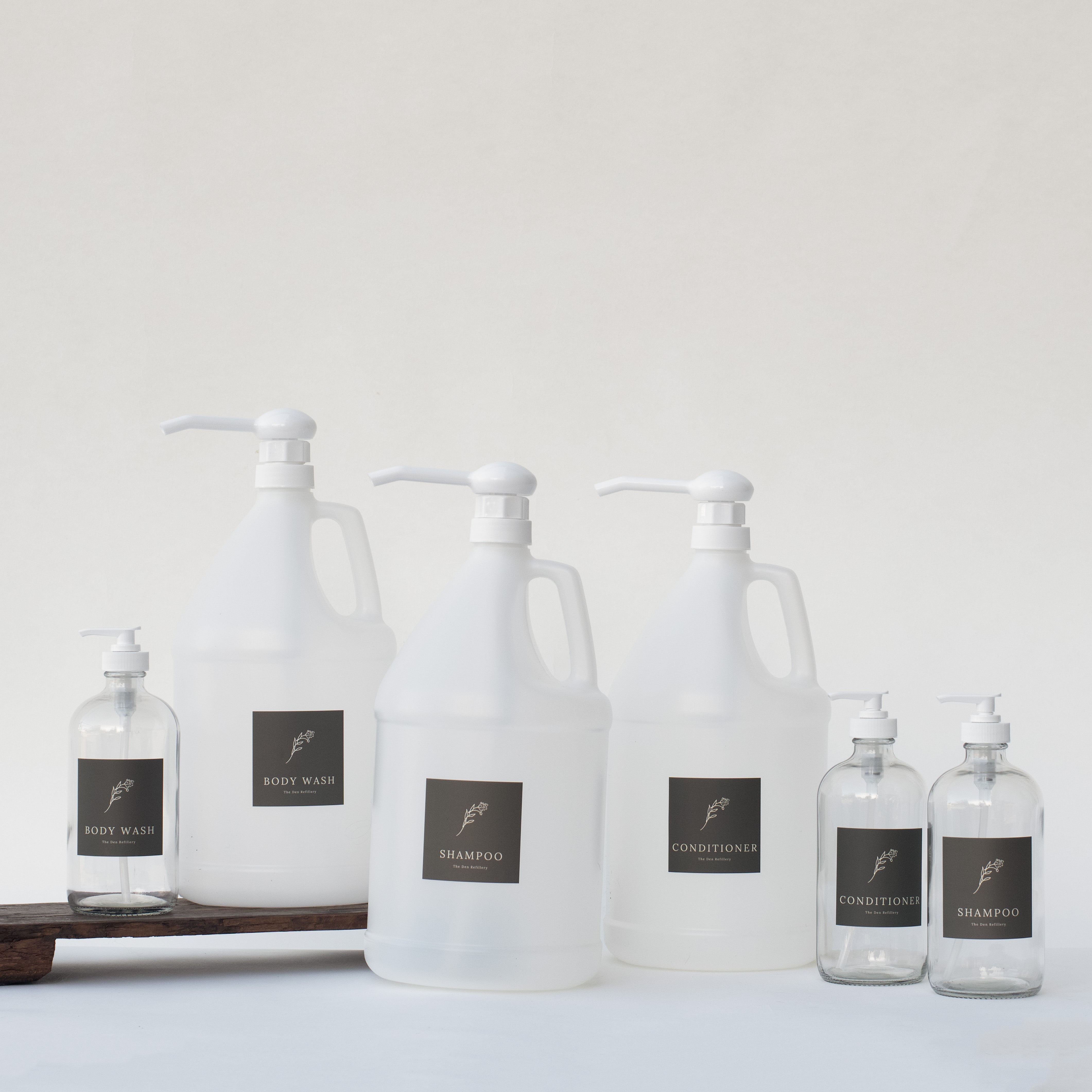 The Den Refillery Bathroom Refill Kit with clear glass bottles.