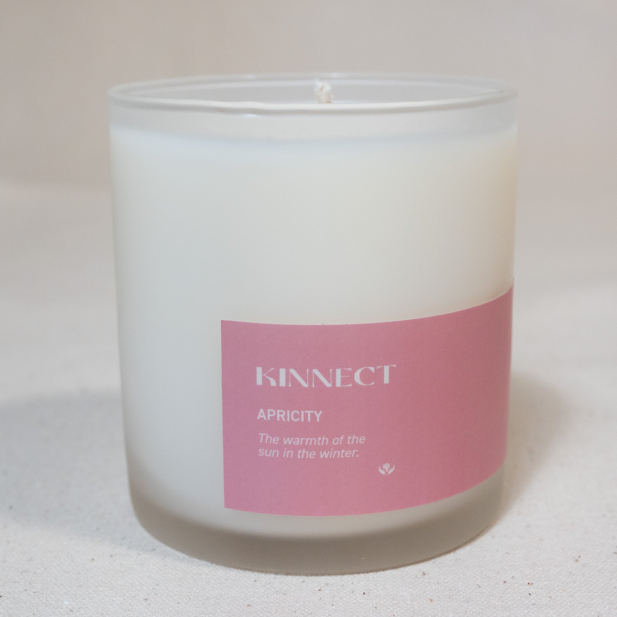 8oz Apricity candle in frosted glass vessel