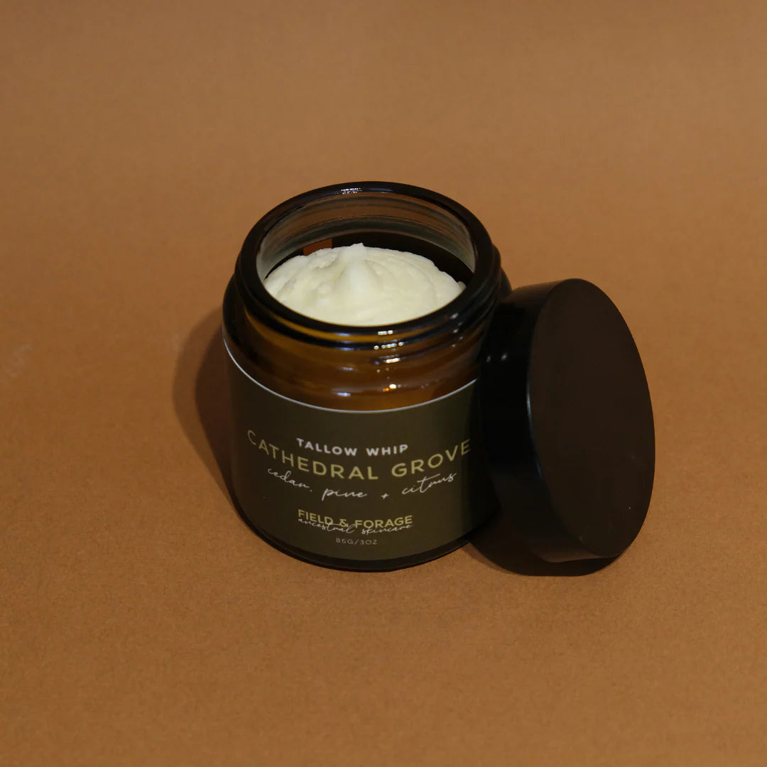 Jar of Cathedral grove Tallow Whip with a black lid on a brown background