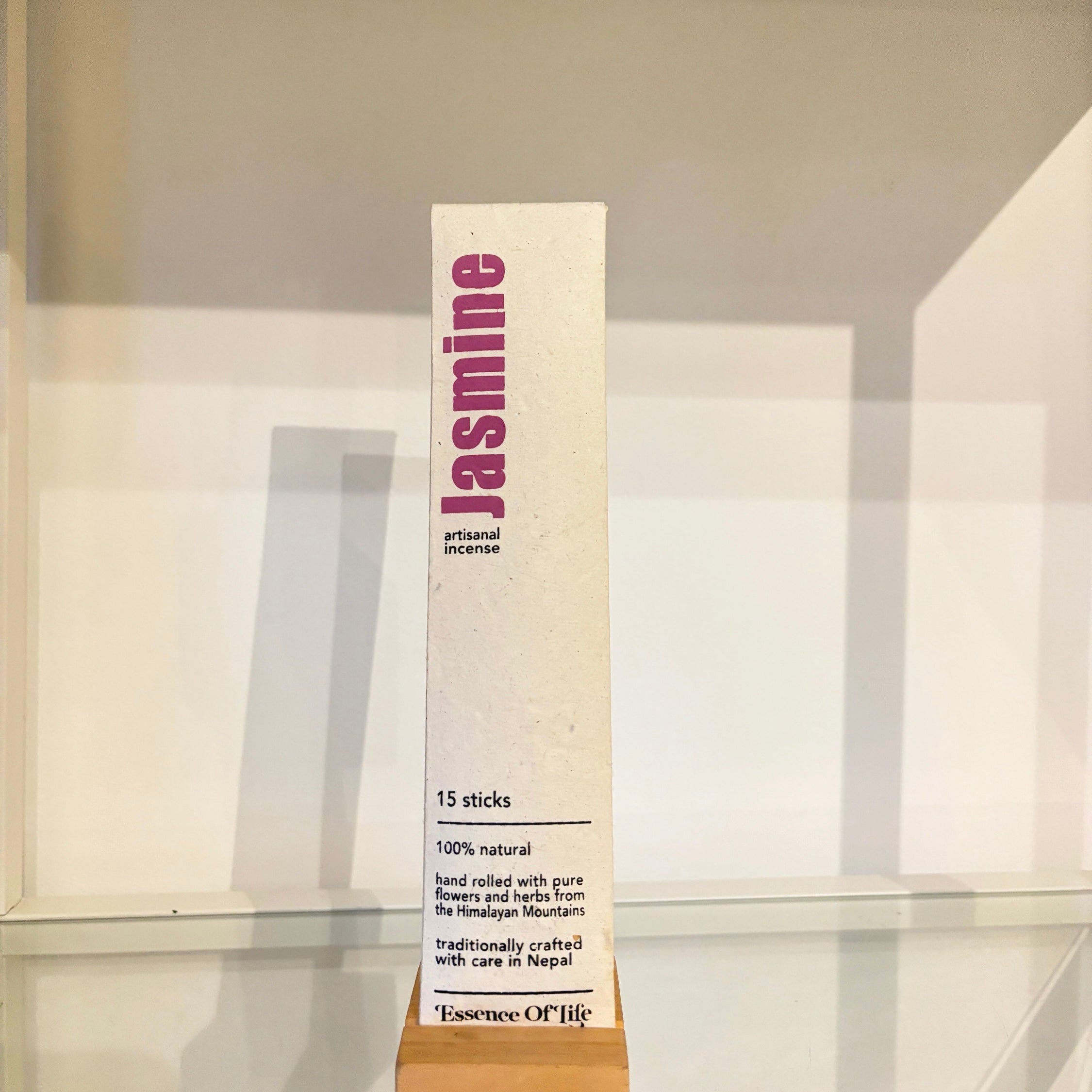 Jasmine incense packaging on a glass shelf