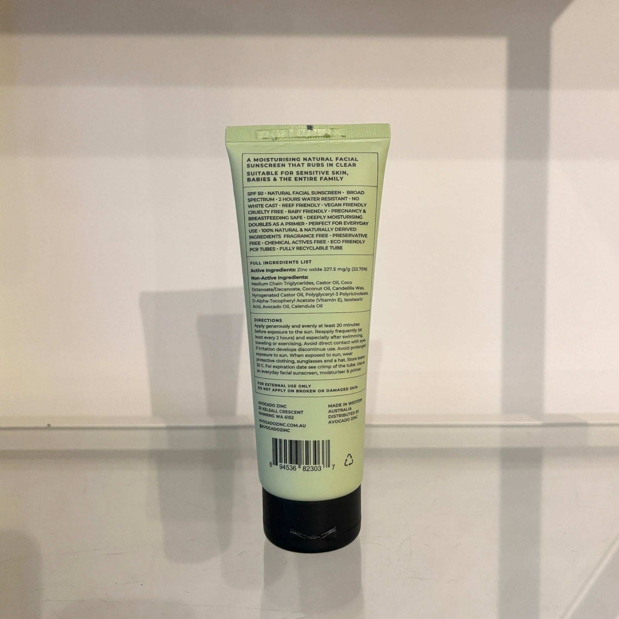 Green tube of Avocado Zinc with text on a white background