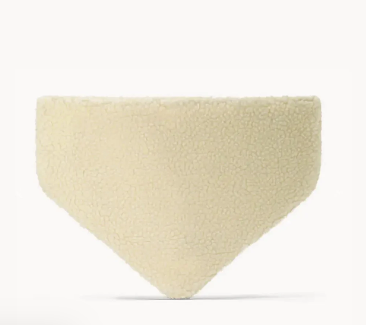 Beige triangle-shaped cushion on a white background