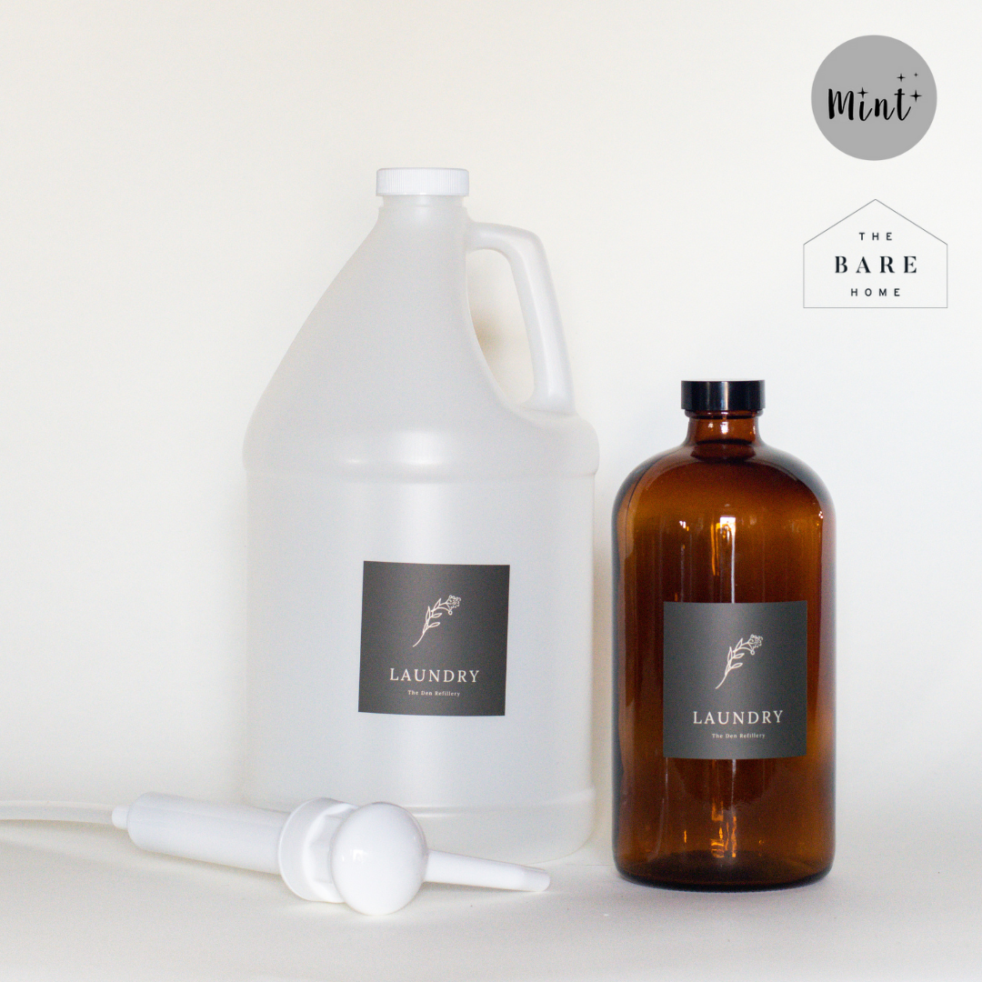 The Den Refillery Laundry Soap kit with a 1L amber glass bottle, plastic 4 litre growler, and 4 litre pump