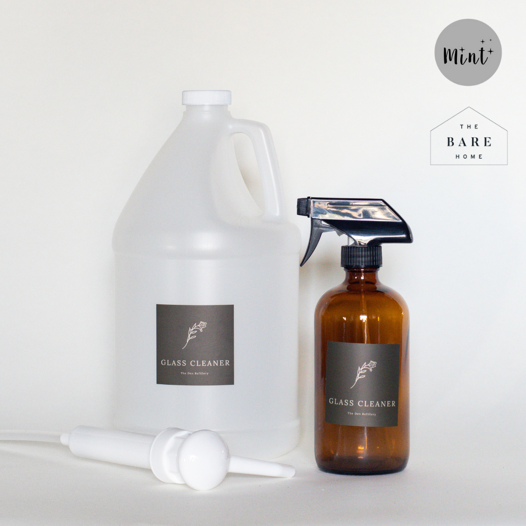 The Den Refillery Glass Cleaner Kit with an amber glass bottle