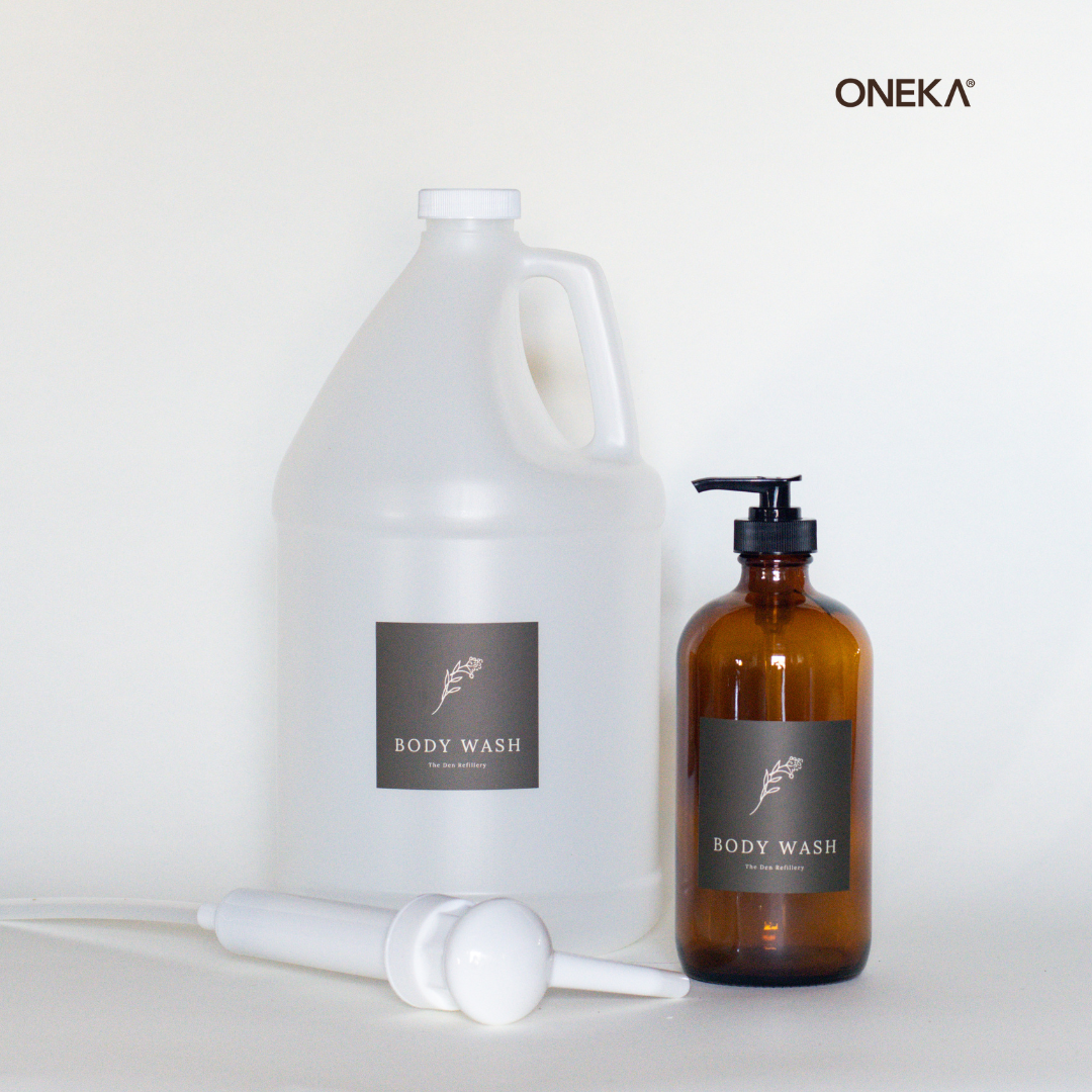 The Den Refillery Body Wash Kit with amber glass bottles.