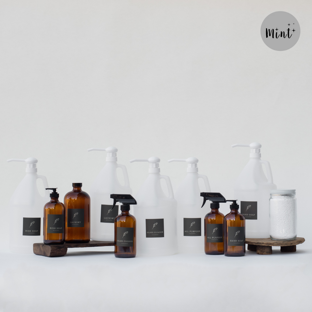 The Den Refillery Deep Cleaning Kit with amber glass bottles.