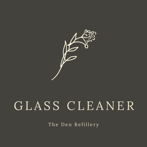 The den refillery black glass cleaner label with an illustrated salal branch and white lettering