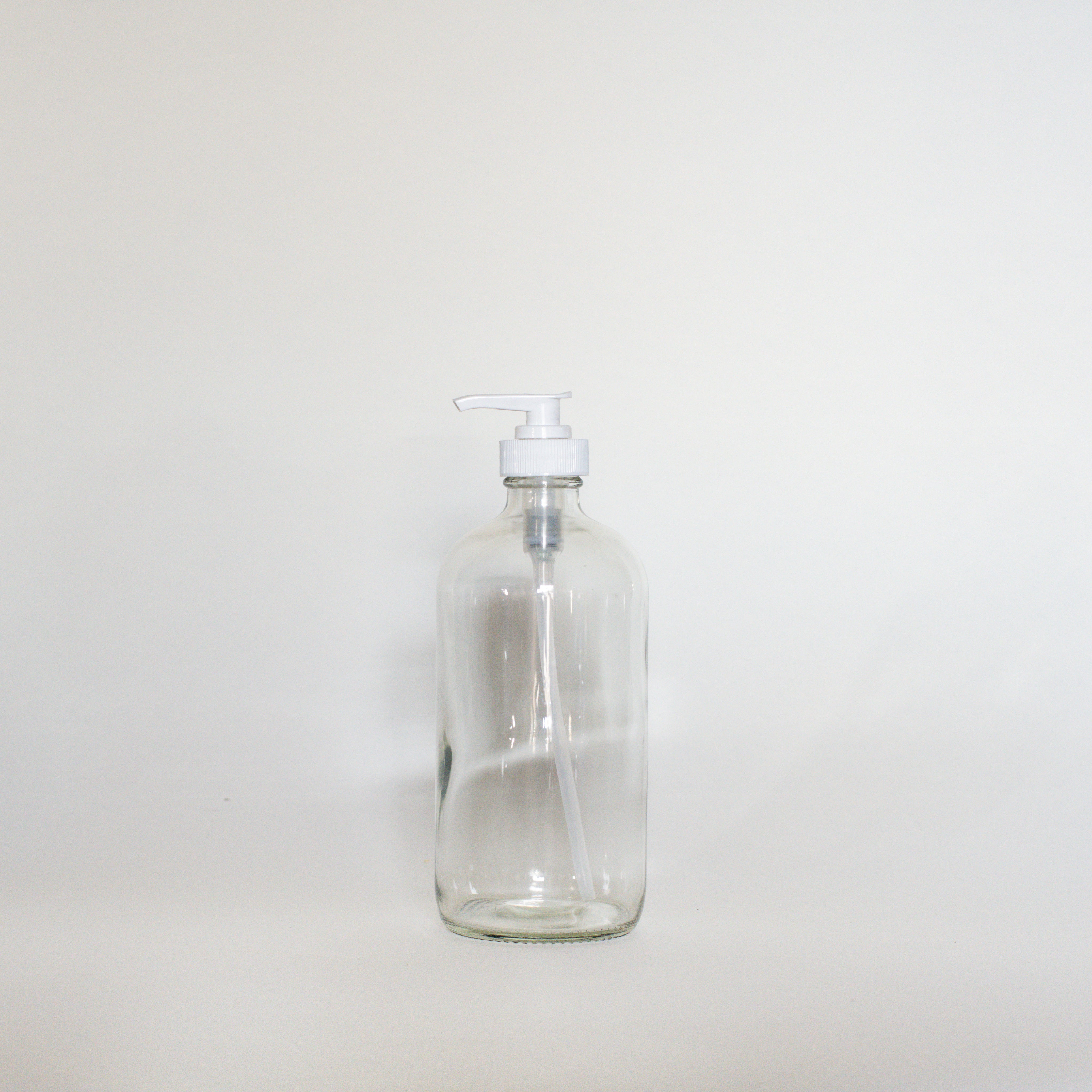 Clear Glass Bottles - The Den Ucluelet