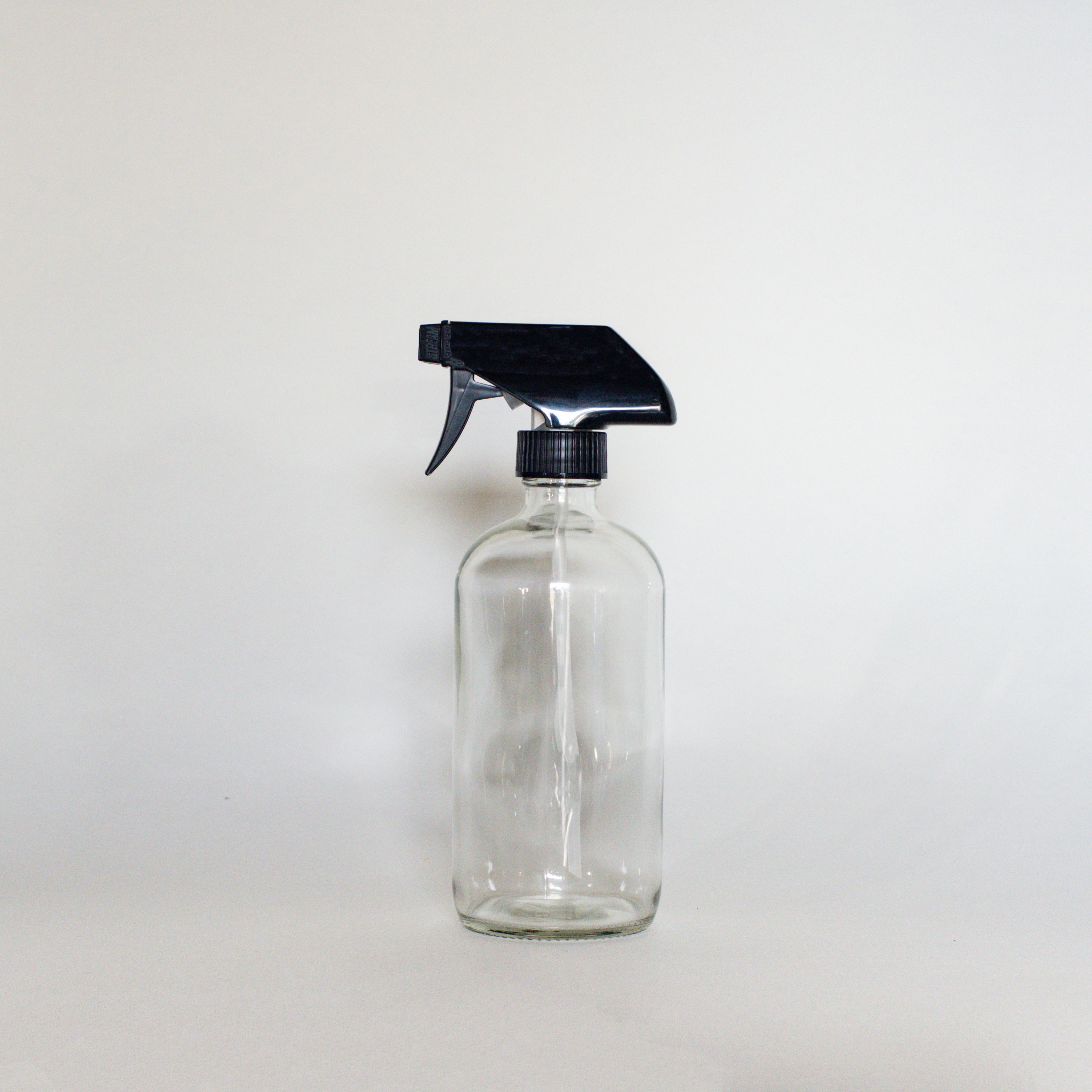 Clear Glass Bottles - The Den Ucluelet