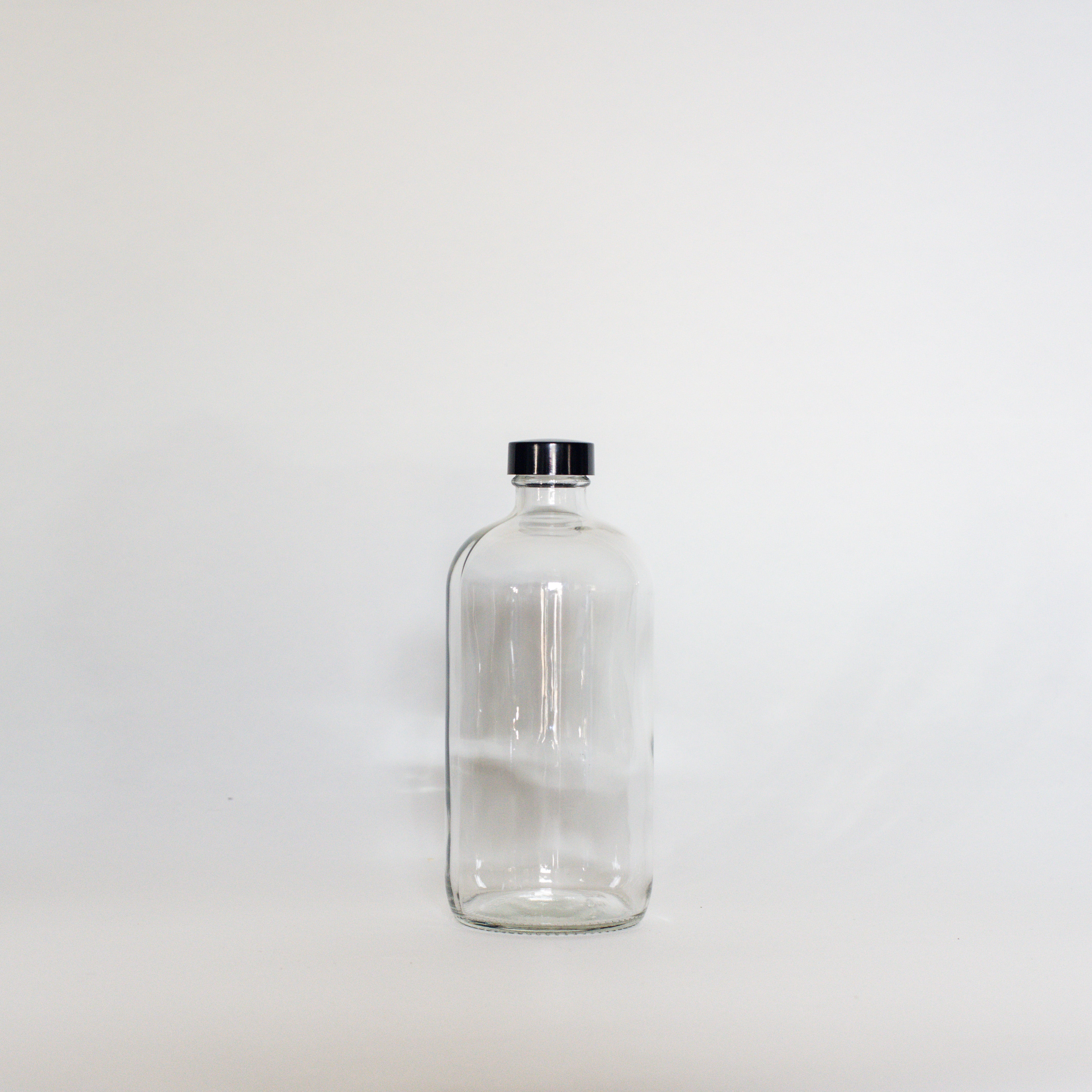 Clear Glass Bottles - The Den Ucluelet