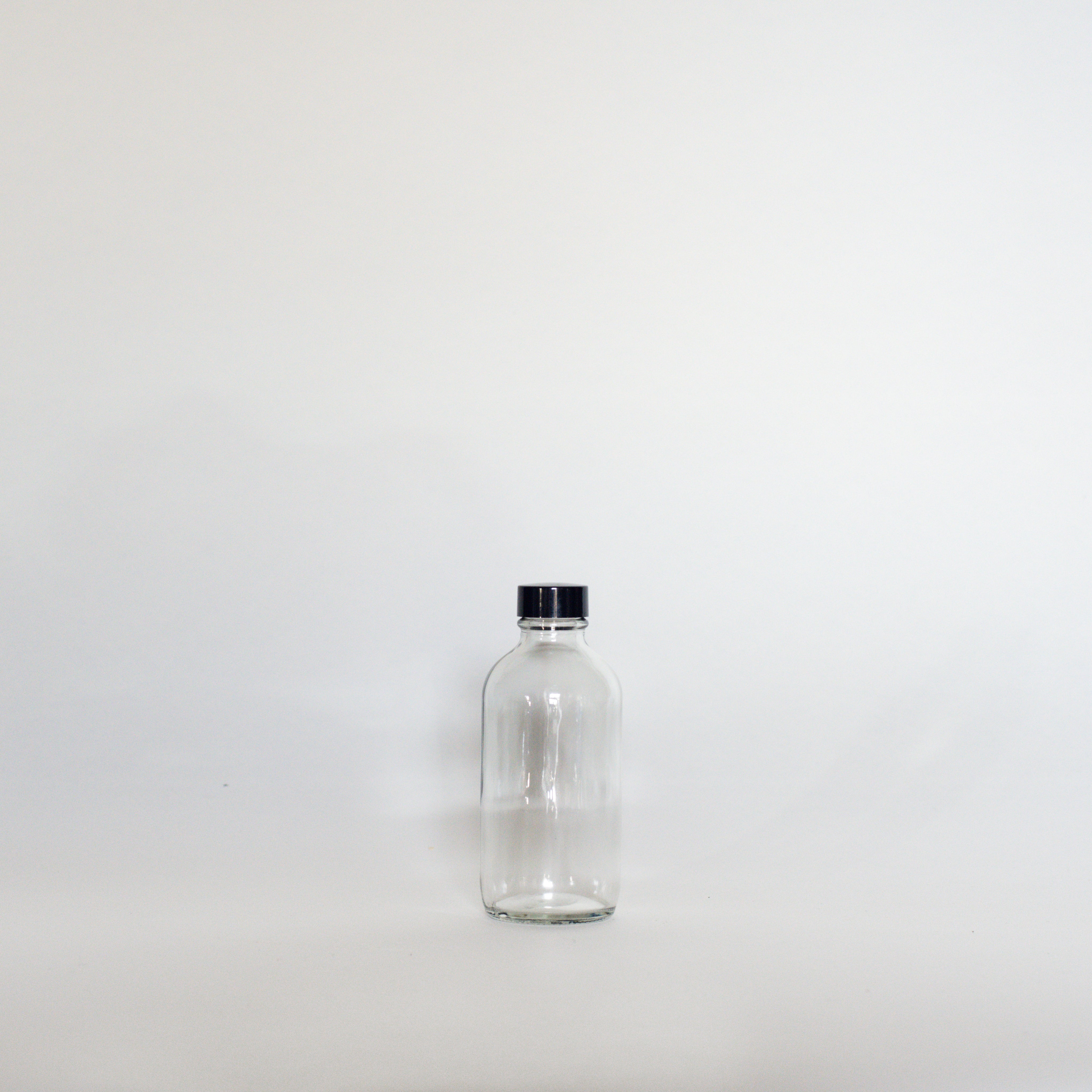 Clear Glass Bottles - The Den Ucluelet