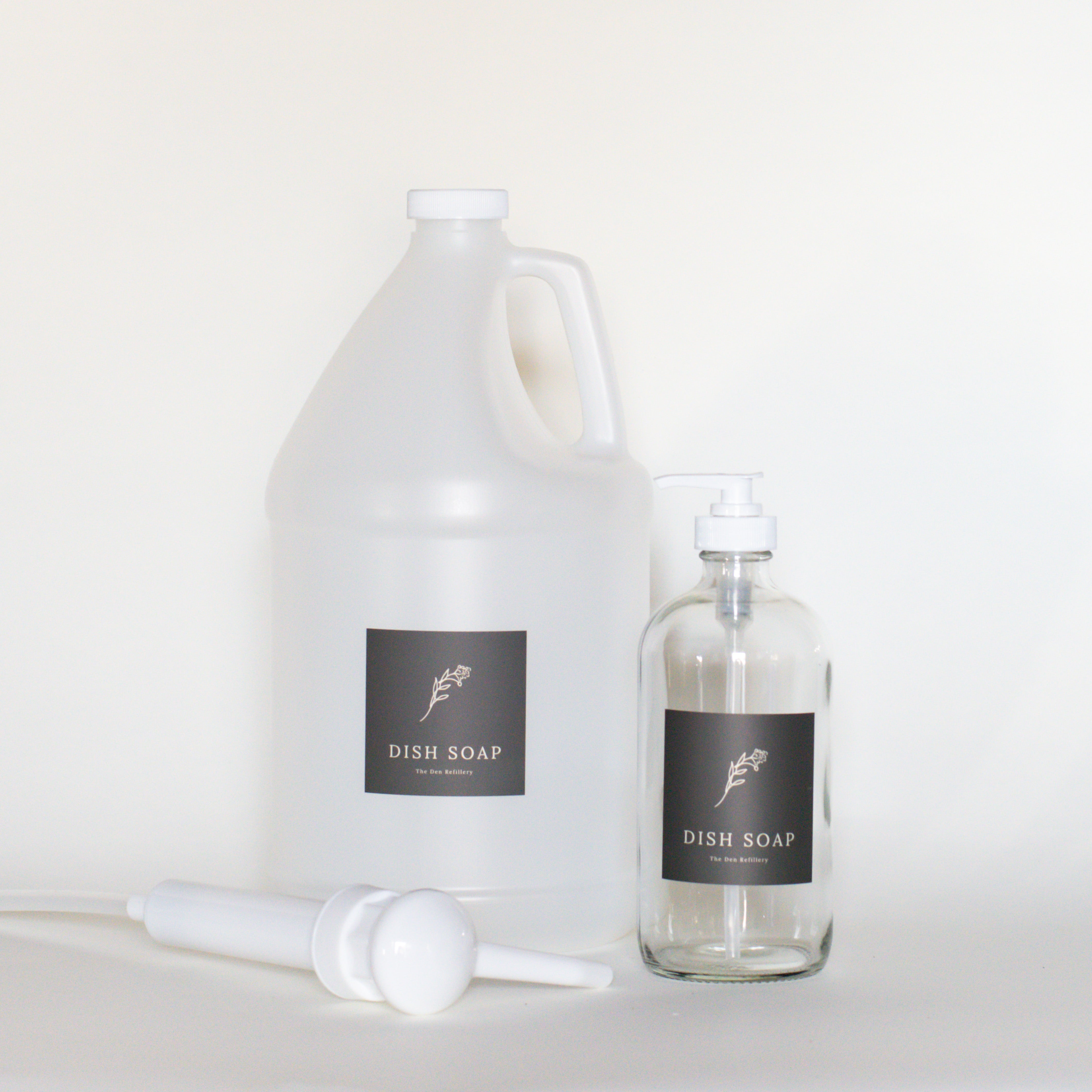The Den Refillery Dish Soap refill kit with a clear glass bottle