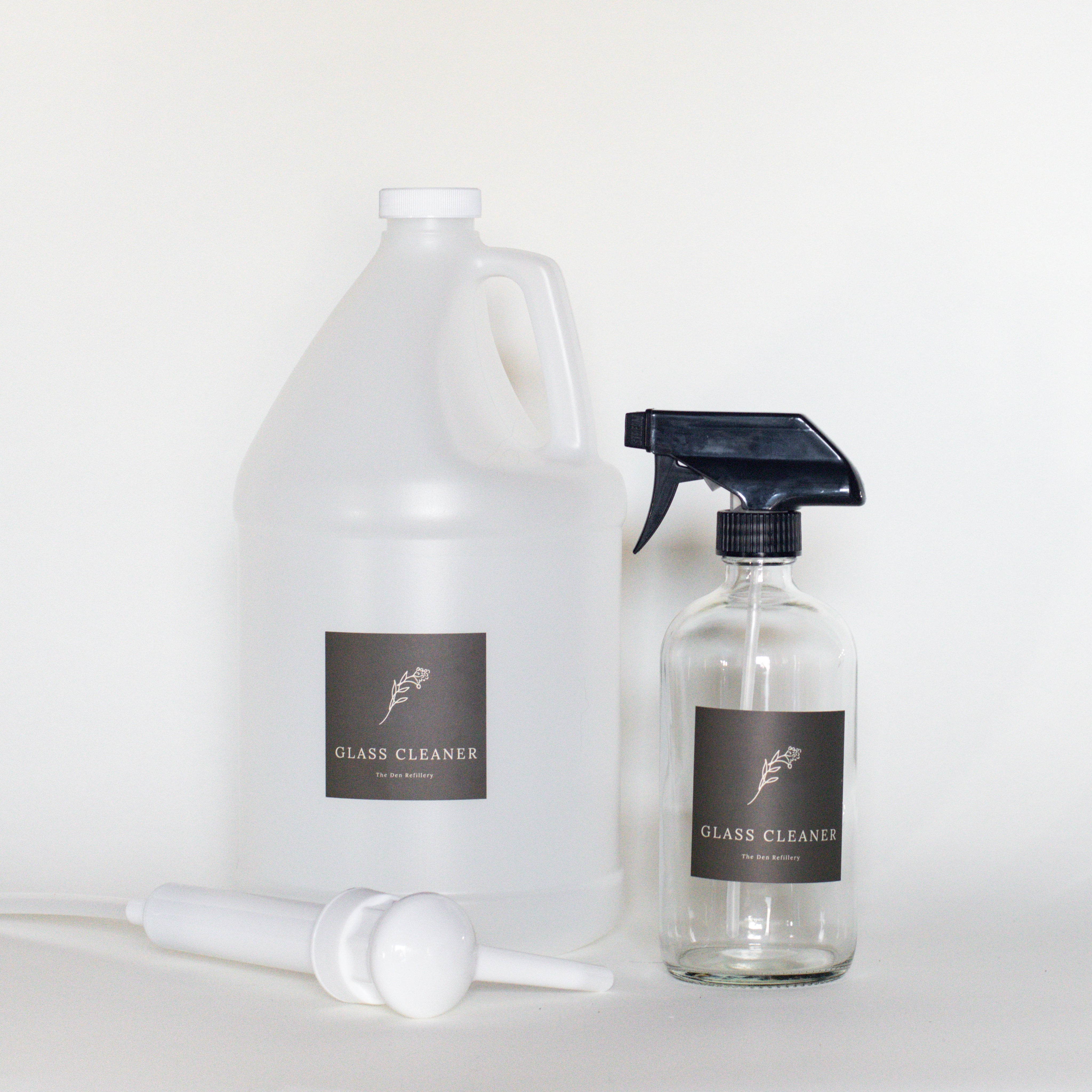 The Den Refillery Glass Cleaner Kit with a clear glass bottle