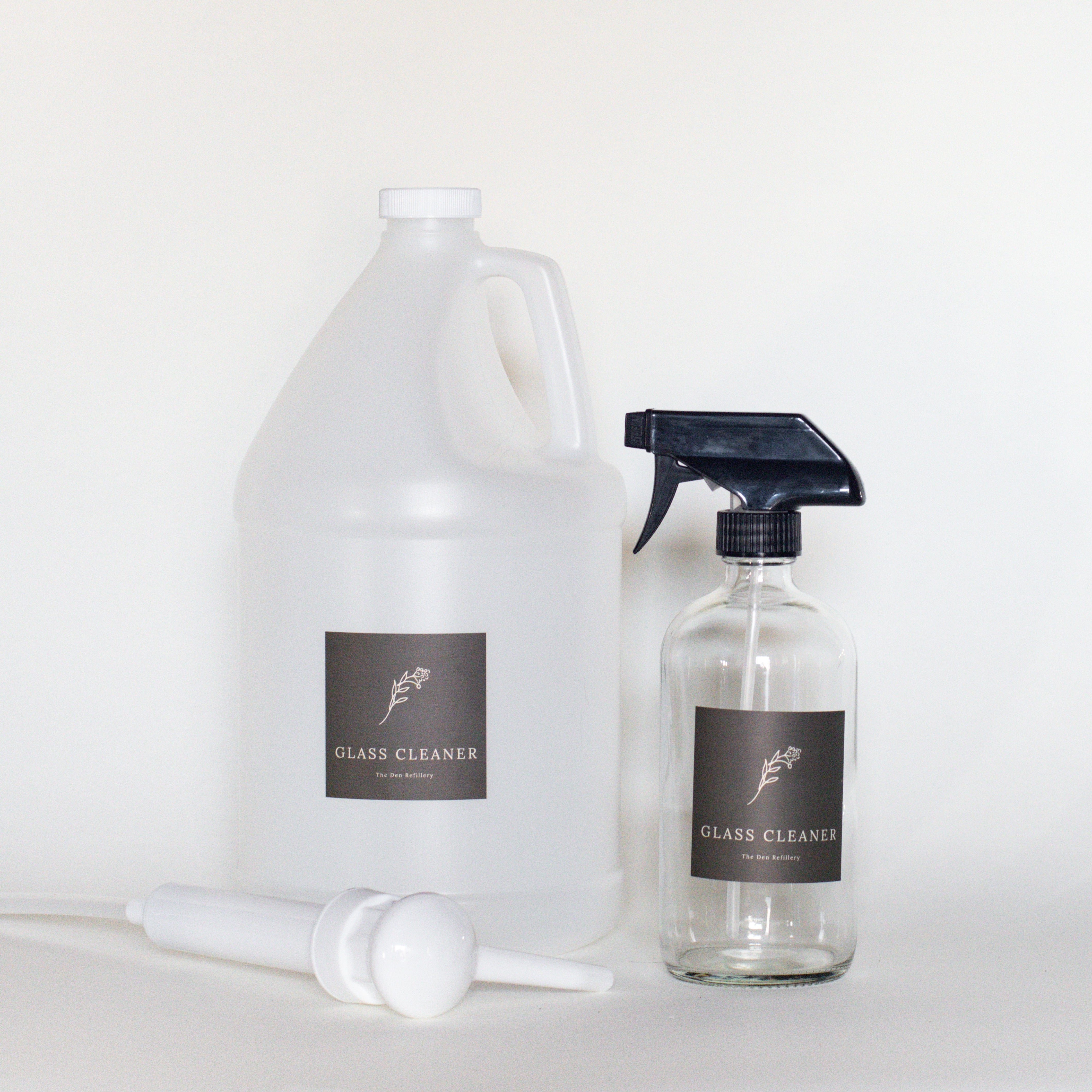 The Den Refillery Glass Cleaner Kit with a clear glass bottle