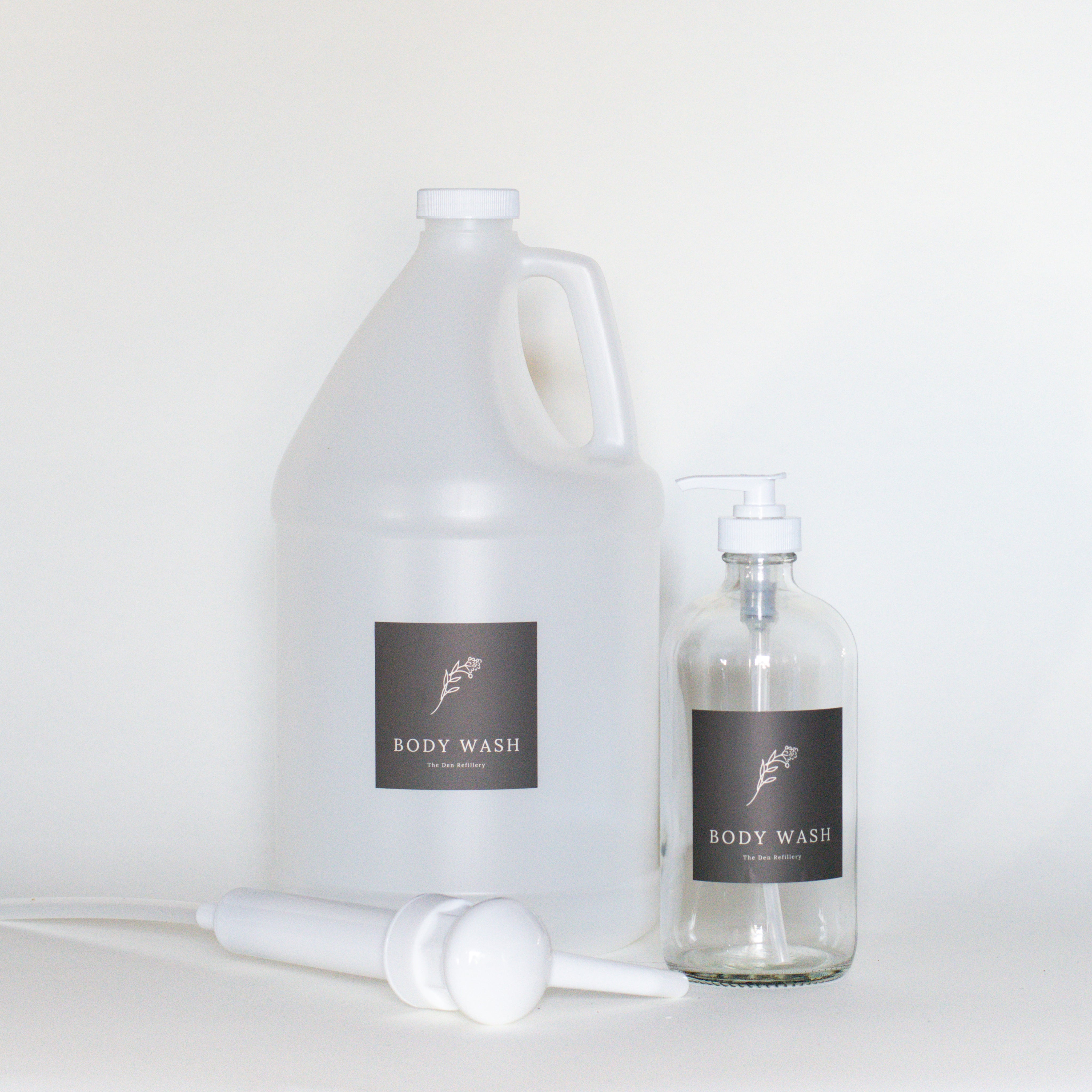 The Den Refillery Body Wash Kit with clear glass bottles