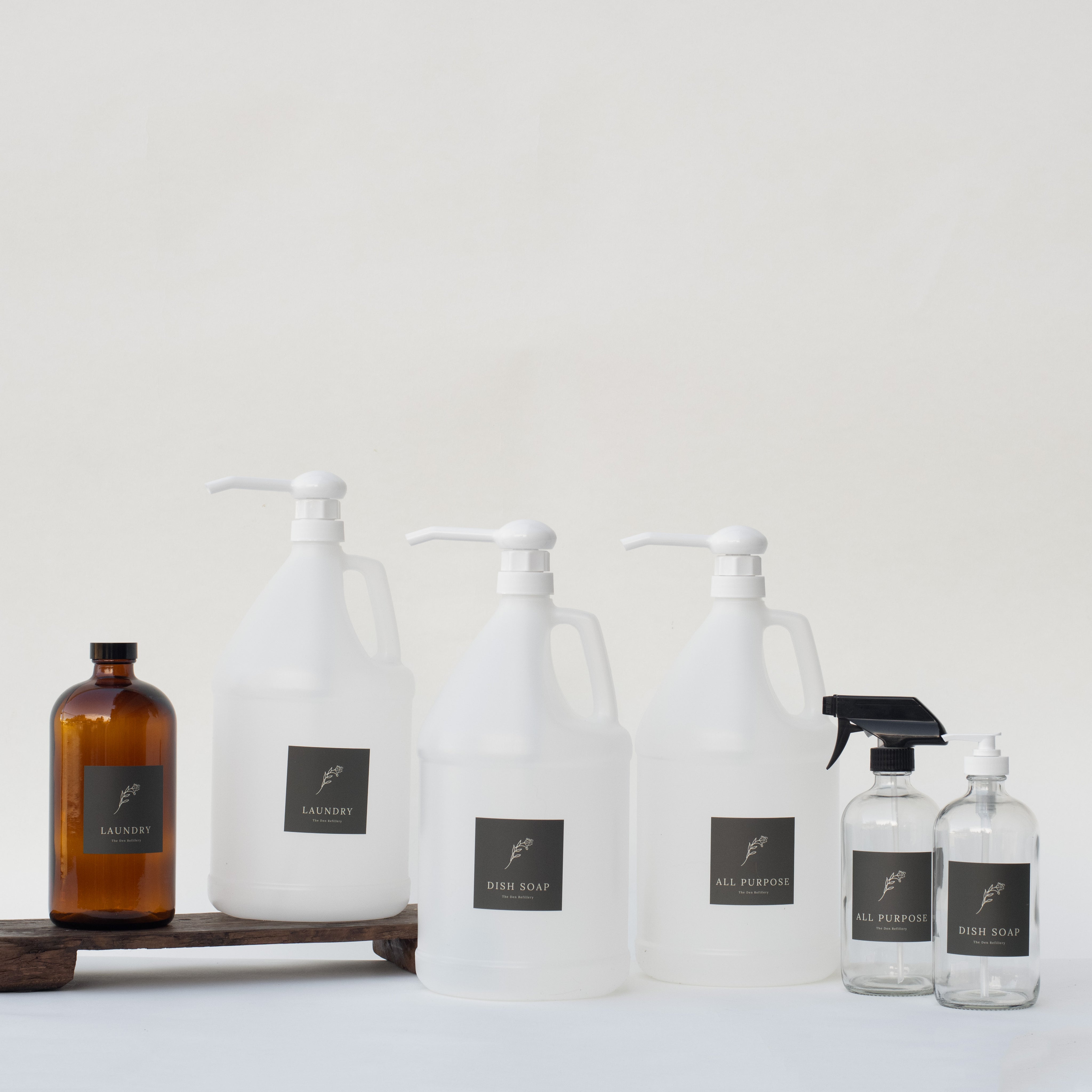 The Den Refillery Cleaning Refill Starter Kits with clear glass bottles