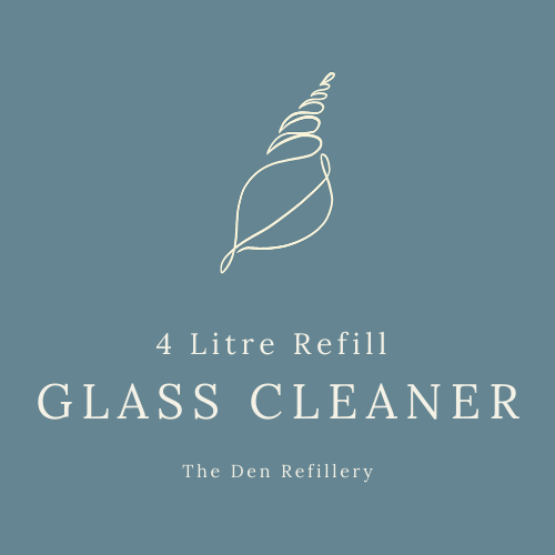 The den refillery blue glass cleaner label with an illustrated sea shell and white lettering